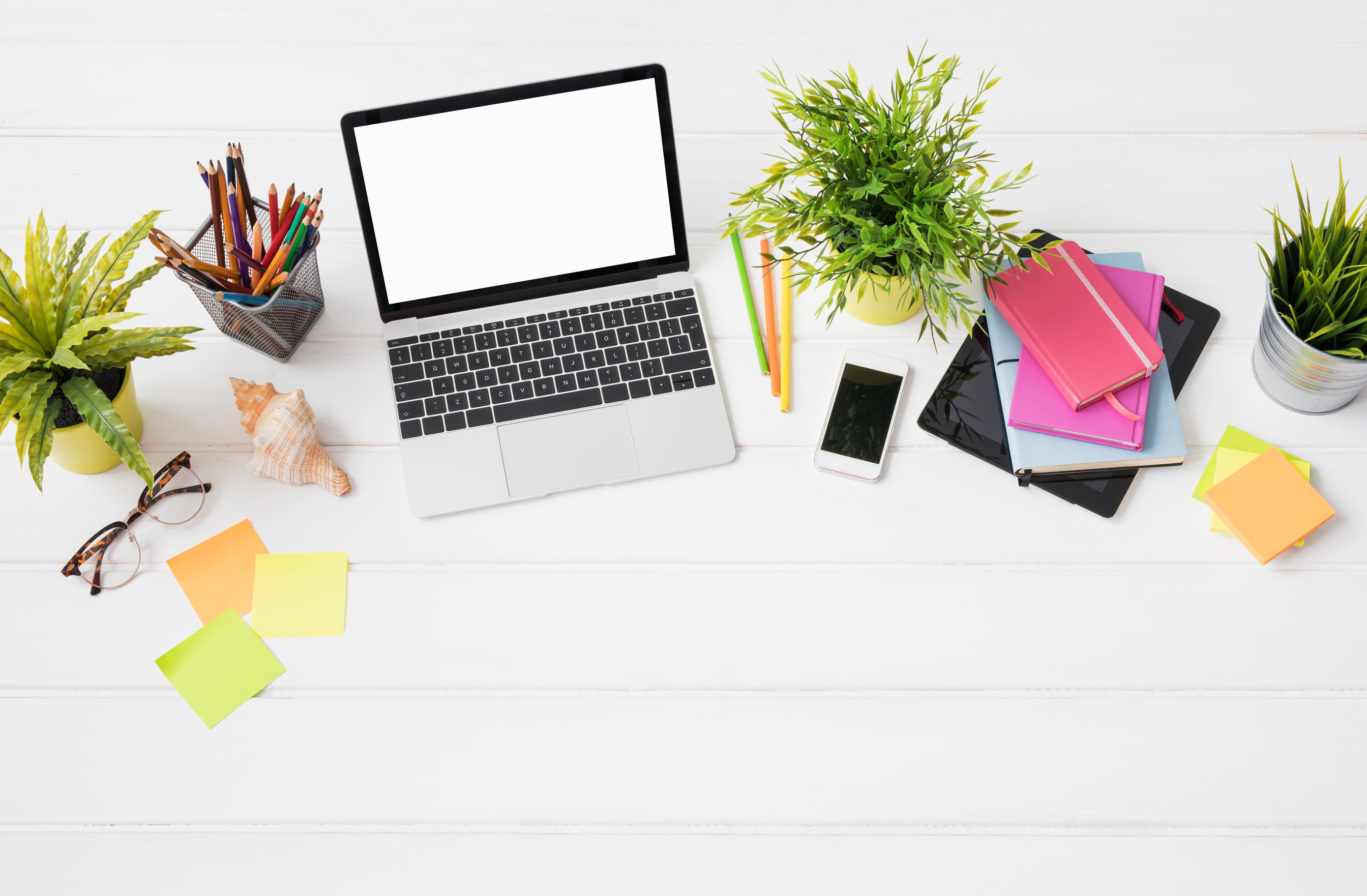 Creative Person's Desk from above in Marketing Agency